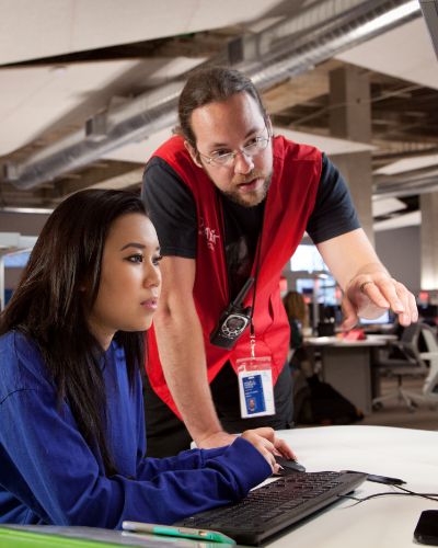 ACCelerator staff assisting a student.